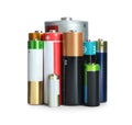 Many batteries of different types on white background