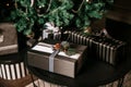 Many beautiful Christmas presents lie under the tree on the floor Royalty Free Stock Photo