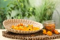 Many beautiful fresh calendula flowers on table against blurred green background, space for text Royalty Free Stock Photo