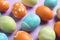 Many beautiful painted Easter eggs on color background Royalty Free Stock Photo