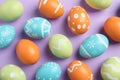 Many beautiful painted Easter eggs on color background Royalty Free Stock Photo