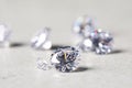 Many beautiful shiny diamonds on light background, closeup Royalty Free Stock Photo