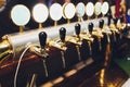 Many beer taps in the beer bar. Royalty Free Stock Photo