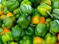 Many bell pepper on counter in grocery store close up