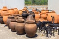 Many big clay vases outside at pottery shop