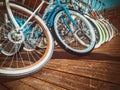 Many bikes in a row on the street. Bicycle parking. Colored bicycles on the street