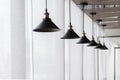 Many black ceiling lamp on window. Royalty Free Stock Photo