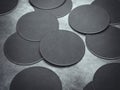 Many black circle beer coasters. 3d rendering