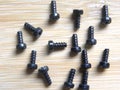 Many black color metal screws Royalty Free Stock Photo