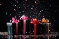 many black gift boxes with a colorful bow on festive dark background with confetti Royalty Free Stock Photo