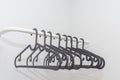 Many black hangers. isolated on white wall background. Store concept, sale, design, empty hanger. Copy space Royalty Free Stock Photo