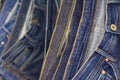 Many blue jeans on the rack background Royalty Free Stock Photo