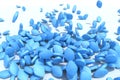 Many blue pills fall on white background Royalty Free Stock Photo