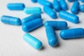 Many blue pills on light surface Royalty Free Stock Photo