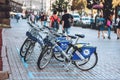 Many blue shared bikes Nextbike on Kiev street parking. Bicycle rental service spot on city street. Public transportation.
