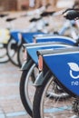 Many blue shared bikes Nextbike on Kiev street parking. Bicycle rental service spot on city street. Public transportation.