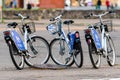 Many blue shared bikes Nextbike on Riga street parking, bicycle rental service spot on city street
