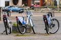 Many blue shared bikes Nextbike on Riga street parking, bicycle rental service spot on city street