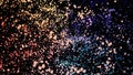 Many blue, yellow, red, lilac rotating particles in space on black background. Animation. Colorful cloud of small Royalty Free Stock Photo