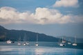 Many boats anchored in blue waters