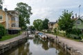 Many boats line the canals of the harbor front in the idyllic Swedish village of Trosa