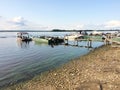 Many boats near the river with a rocky shore Royalty Free Stock Photo