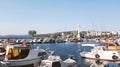 many boats, sailboats, motorboats and yachts moored in the marina