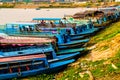 Many boatsmen in port of floating village, Phnom Krom, Tonle Sap, Cambodia