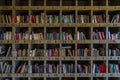 Many books on a large bookshelf