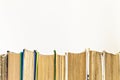 Many books standing in a row isolated Royalty Free Stock Photo