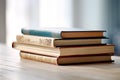 Many books on the table against the background of an old brick wall Royalty Free Stock Photo