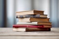 Many books on the table against the background of an old brick wall Royalty Free Stock Photo