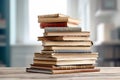 Many books on the table against the background of an old brick wall Royalty Free Stock Photo
