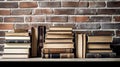 Many books on the table against the background of an old brick wall Royalty Free Stock Photo