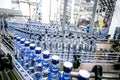 Many bottles of alcohol on assembly line on factory