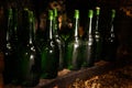 Many bottles of alcohol drinks on shelf in cellar Royalty Free Stock Photo