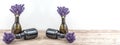 Many bouguet of violet purple lavendula lavender flowers herbs in old brown vases pharmacy bottle, on white background and Royalty Free Stock Photo