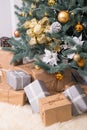 Many boxes with Christmas gifts under the Christmas tree Royalty Free Stock Photo