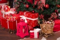 Many boxes with Christmas gifts under the Christmas tree