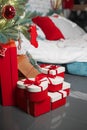 Many boxes with gifts under Christmas tree in interior Royalty Free Stock Photo