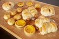 Many breads laid on a wooden table