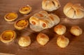 Many breads laid on a wooden table