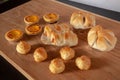 Many breads laid on a wooden table