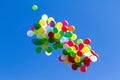 Many bright baloons in the blue sky Royalty Free Stock Photo