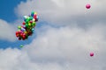 Many bright baloons in the blue sky Royalty Free Stock Photo