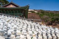 Many of the 500 BuddhaÃ¢â¬â¢s Disciples statues by a temple hall in Bomunsa Temple, Seongmodo, Ganghwa, Incheon, Korea