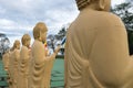 Many Buddha statues in perspective at the buddhist temple