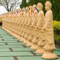 Many Buddha statues in perspective at the buddhist temple