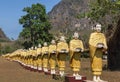 Many buddha statues standing in row at temple in Myanmar Burma