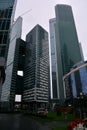 Many buildings of the Moscow business center, from the bottom to the top, diced green stand under a white sky Royalty Free Stock Photo